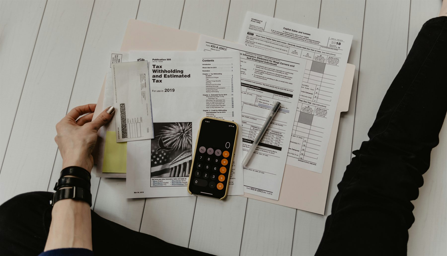 Tax paperwork and receipts spread across a desk